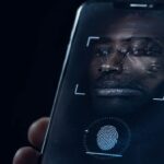 A biometric verification prompt on a phone screen with an unresolved facial reflection 