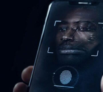 A biometric verification prompt on a phone screen with an unresolved facial reflection 